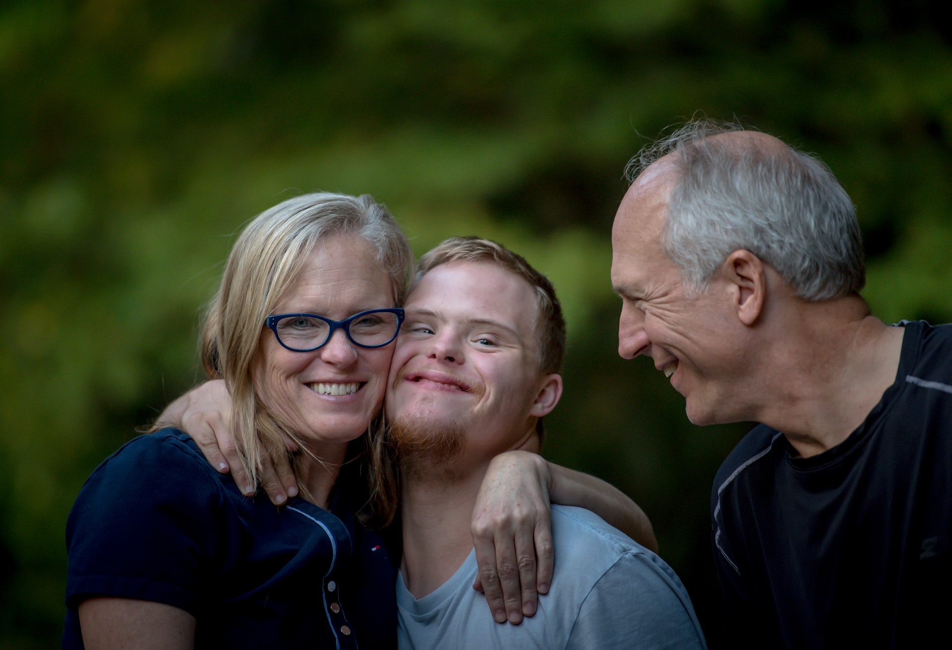 Loving family with down syndrome boy