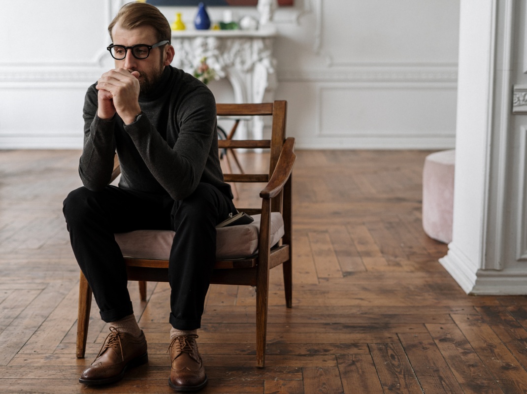 Man reflecting in chair